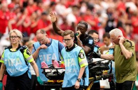 Canada's Ismael Kone waves to the crowd after suffering a serious injury in the 6-0 win over Qatar