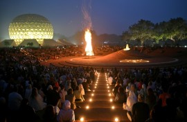 Huge draw: visitors and residents at a bonfire celebration near the 'Temple of the Mother' in India's Auroville spiritual community
