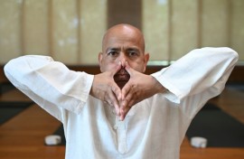 Varun Veer, founder of Lifeyoga, demonstrates 'Pranayama' at his studio in New Delhi