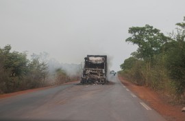 A burned truck is seen abandoned in the middle of the road leading to Sikasso, Mali in May 2026