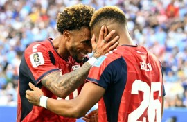 Cape Verde's forward Helio Varela (26) celebrates with teammate Ryan Mendes after scoring his team's equaliser in a 2-2 draw with Uruguay