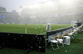 The rain pours onto the World Cup stadium in Philadelphia, forcing France's game against Iraq to be suspended for more than two hours