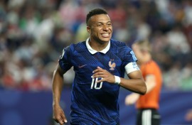 Kylian Mbappe admitted the long storm delay took its toll on France against Iraq -- but he scored two more World Cup goals in their 3-0 win