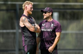 England captain Ben Stokes (L) talks to coach Brendon McCullum
