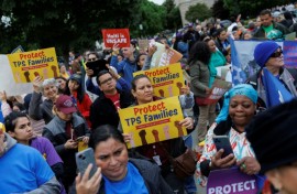 Demonstrators chanted and held signs outside the US Supreme Court as it weighed ending temporary protected status for Haitians and Syrians
