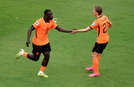 Dutch forward Brian Brobbey (left) celebrates scoring against Tunisia in their World Cup Group F match in Kansas City