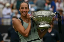Madison Keys poses with the trophy after beating Tatjana Maria in the Eastbourne final