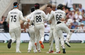New Zealand's Mitchell Santner (2R) is congratulated after dismissing England's Jamie Smith to seal a 160-run win for the Black Caps in the third Test at Trent Bridge