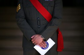 A member of the military stands guard on the first day of the 2026 Wimbledon Championships