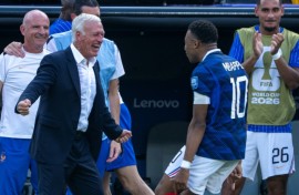 Kylian Mbappe celebrates with France coach Didier Deschamps