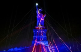 The Statue of Liberty is illuminated during the "Liberty Lights" event celebrating the 250th anniversary of US independence