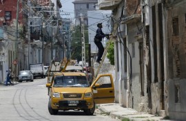 An electrician works on the power grid in Havana during a nationwide power outage in Cuba, the third in six months