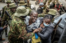 Kenyan police swarmed on a tiny group trying to protest
