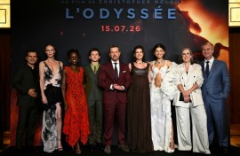 The cast of "The Odyssey" pose with director Christopher Nolan (right) at the Paris premiere