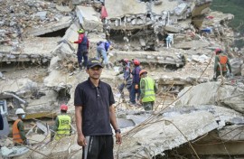 Miguel Baez is looking for the bodies of his family members in the hopes of giving them a dignified burial
