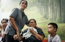 Relatives of victims of the fire waiting at the Police General Hospital in Bangkok on July 14