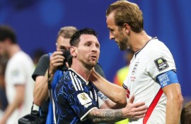 Lionel Messi with England captain Harry Kane