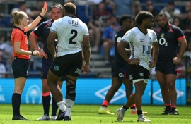 Referee Hollie Davidson shows a red card to Fiji's scrum-half Simione Kuruvoli (right) during the Nations Championship match against England