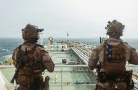 This handout photograph taken on July 16, 2026 by US Central Command Public Affairs shows US Marines from the 11th Marine Expeditionary Unit conducting a verification boarding aboard the M/T Wen Yao in the Gulf of Oman