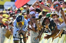 Remco Evenepoel crosses the finish line in a winning time in Thonon-les-Bains