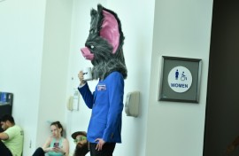 A cosplayer waits by the restrooms during Comic Con International in San Diego