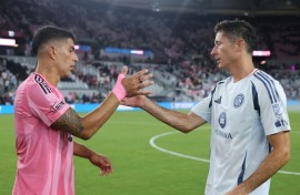 Luis Suarez of Inter Miami (left) and Robert Lewandowski of Chicago Fire after Miami's win