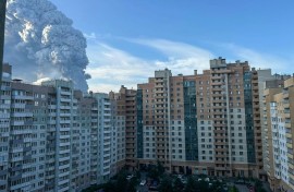 Smoke rises into the sky over residential buildings in Saint Petersburg on July 24, 2026