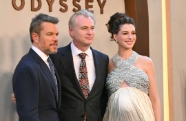British-US director Christopher Nolan is flanked by Matt Damon, who plays Odysseus and Anne Hathaway, who plays Penelope, at the premiere of "The Odyssey" in New York
