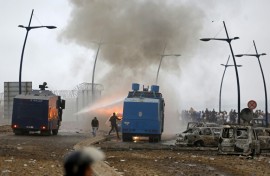 Moroccan security forces use water canon to disperse the crowds at the site of clashes near Fnideq on the Morocco-Spain border