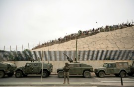 Spain rushed troops, more police, drones, divers and boats to Ceuta