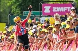 Norwegian rider Sigrid Haugset celebrates her win on stage three of the Tour de France Femmes