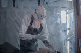 A doctor providing care to a patient with Ebola at a treatment centre in Bunia, capital of the DRC's Ituri province