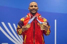 Venezuela's Julio Mayora, seen here in a handout picture from the Central American and Caribbean Games, carried cement blocks to rescue people following the twin earthquakes that struck Venezuela in June