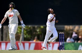 Bangladesh bowler Hasan Mahmud celebrates dismissing Pat Cummins