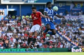 Carlos Baleba (R), playing against Manchester United in May, said the move to the Premier League giants was a 'dream'