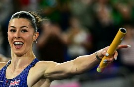 Britain's Amy Hunt celebrates as she crosses the finish line in the European 4x100m mixed relay