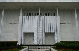 A tarpaulin covers the facade of the Kennedy Center where President Donald Trump's name was removed