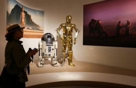 A visitor views exhibits from the Star Wars gallery during the Lucas Museum of Narrative Art press preview in Los Angeles