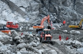 Excavators work during recovery efforts at the site of the destroyed Gyirong Port border crossing in China’s western Tibet region