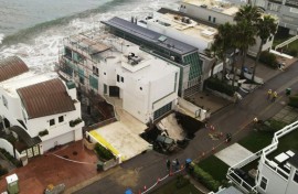 Pounding surf has created a sinkhole on one side of a multi-million dollar house in swanky Malibu that reports said belongs to Nicholas Cage