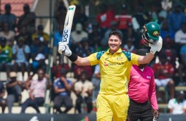 Australian batter Matt Renshaw celebrates his second international century in Harare, almost 10 years after his first