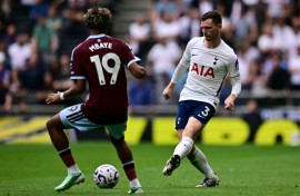 Tottenham full-back Andy Robertson (R)