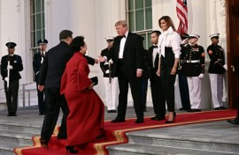 US President Donald Trump and First Lady Melania Trump greet China's President Xi Jinping and his wife Peng Liyuan upon their arrival at the White House for a state dinner