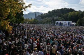 Worshippers packed a field in Lourdes