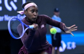 US player Coco Gauff hits a return to China's Sun Xinran during their singles match at the China Open in Beijing