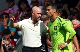 Former Manchester United manager Erik ten Hag speaking to Cristiano Ronaldo