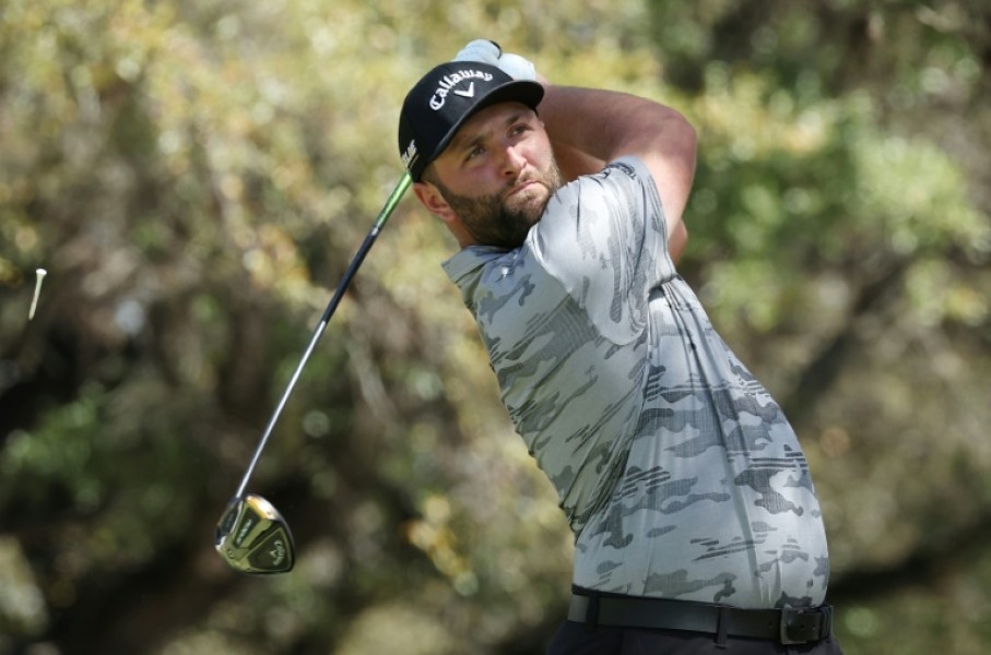 Top-ranked Jon Rahm of Spain lost his match but won his group Friday at the WGC Match Play, advancing to a Saturday knockout showdown against four-time major winner Brooks Koepka