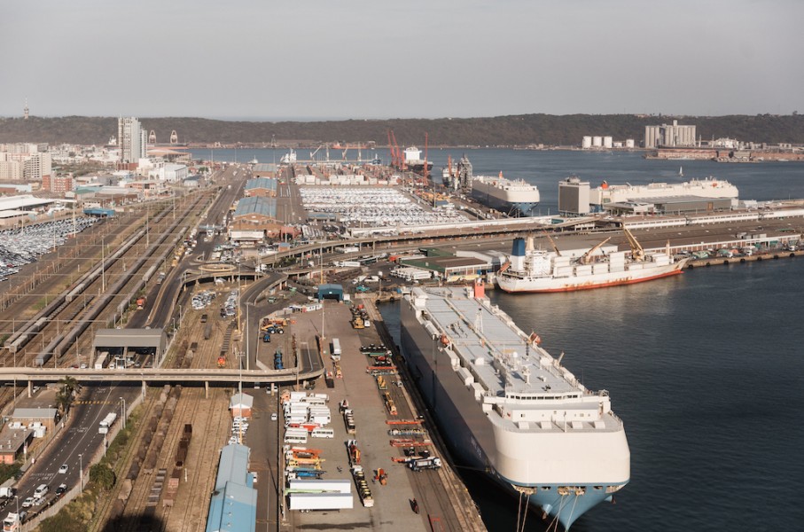 Cargo vessels and trucks are seen at the Port of Durban harbour. AFP/Rajesh Jantilal