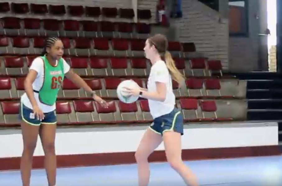 The netball players practicing.
