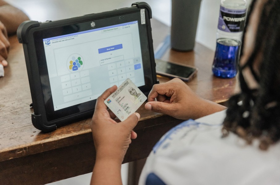 An IEC official checks an ID. AFP/Rajesh Jantilal